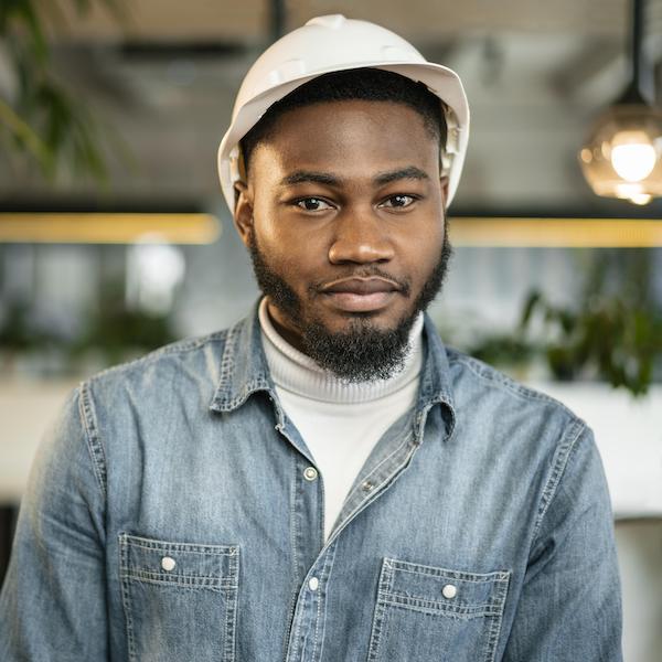 medium-shot-man-posing-with-helmet